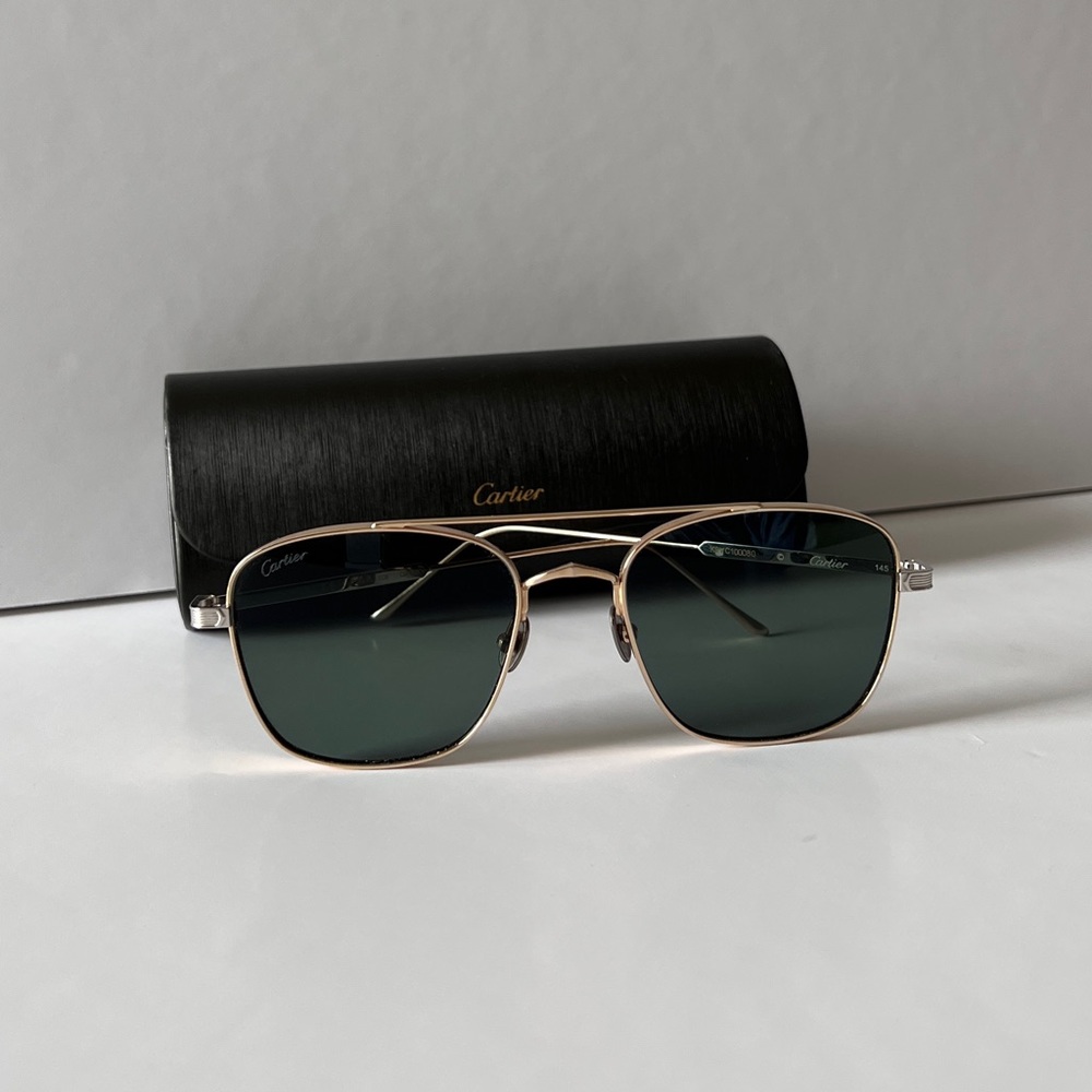 Worn twice, bought in Aruba. Signature C de Cartier sunglasses with green lens